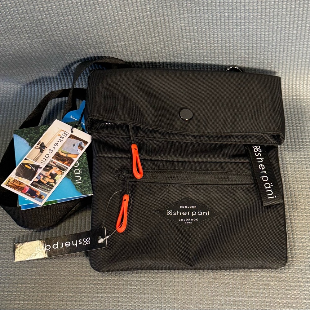 Sherpani Black Crossbody Bag with Red Accents